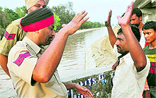 An eyewitness narrates the drowning incident to the police at the Sidhwan Canal in Ludhiana on Thursday; and (below) a diver searches for the victim