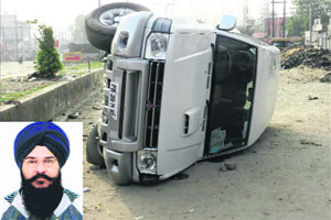 The overturned SUV that was carrying an injured Devinder Singh Rania (inset), senior SAD leader, after a clash in Moga on Thursday. 