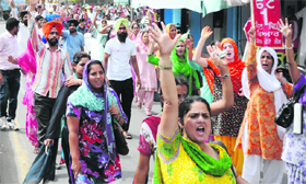 (Above) Special Trainer Resourceperson (STR) teachers hold a protest march in Bathinda on Friday