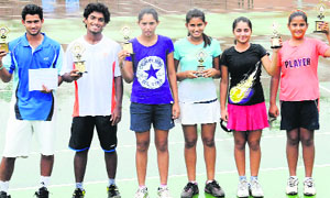Winners strike a pose with their trophies after  the CLTA-AITA Talent Series Tennis Tournament at CLTA, Sector 10,  Chandigarh, on Friday. 