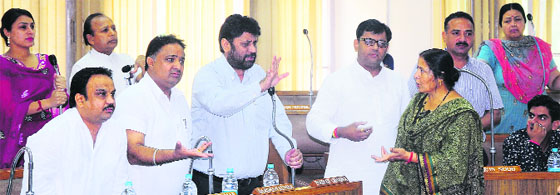 Congress and BJP councillors argue at the MC House in Chandigarh on Friday.