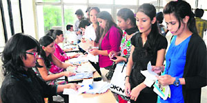 Students register their names for interviews during a job fest at Post Graduate Government College, Sector 46, Chandigarh, on Friday. 