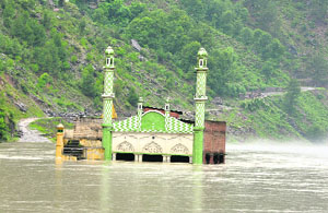A view of the Pul Doda-Khelani link road behind a mosque submerged into the reservoir of Baghlihar power project in Doda. 