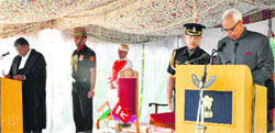 NN Vohra being administered the oath of office as Governor of J&K for a fresh term by Chief Justice of the J&K High Court MM Kumar at Raj Bhawan in Srinagar on Friday. 