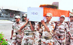 ITBP personnel carry the coffin of Inspector Bhim Singh, who lost his life in an air crash during a rescue mission in Uttarakhand on June 25, at Technical Airport in Jammu on Friday. Tribune photo: Anand Sharma