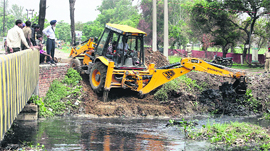 The work to clean the Kala Sanghian drain starts on the Maqsudan stretch in Jalandhar on Friday.