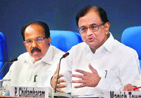 Union ministers P Chidambaram and Veerappa Moily at a press conference in New Delhi on Friday.