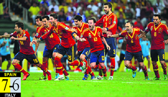 Spain celebrate after midfielder Jesus Navas scored his penalty in the shoot-out at the end of the extra time and defeating Italy in the Confederations Cup at the Castelao Stadium in Friday. 
