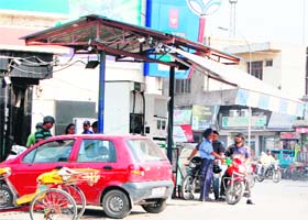 Customers queue up at a filling station in Amritsar on Saturday