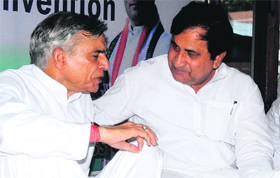 Shakeel Ahmad, in charge, city Congress party affairs (right), interacts with MP Pawan Kumar Bansal at Congress Bhawan, Sector 35, Chandigarh, on Saturday.