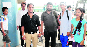 Members of a family from Ludhiana who were rescued from Gobind Ghat in Uttarakhand, at the Sector 43 ISBT, Chandigarh, on Saturday.
