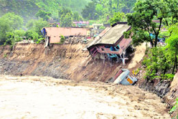 Houses damaged by riverwater at Balvakot in Pithoragarh. 