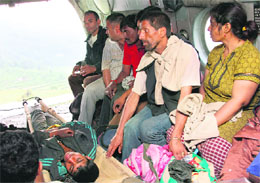 Rescued pilgrims, along with an injured person, in an IAF Mi-17 helicopter 