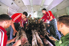 Firewood being loaded on an IAF helicopter for mass cremations at Kedarnath. 