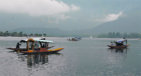 Tourists enjoy boat rides at the Dal Lake in Srinagar on Saturday.
