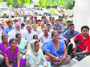 Followers of Dera Sacha Sauda outside DCP Harash Bansals office in Ludhiana on Saturday. 