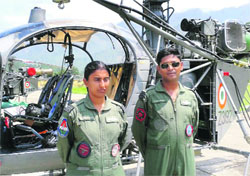 Sq Ldr Vipin Takawale (R) and co-pilot Sq Ldr Kusbhoo Gupta at Gauchar helipad in Uttarakhand. A Tribune photograph