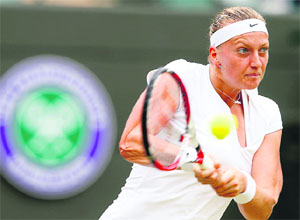 Petra Kvitova of the Czech Republic hits a return to Ekaterina Makarova of Russia in their match at the Wimbledon Tennis Championships, in London on Saturday. 