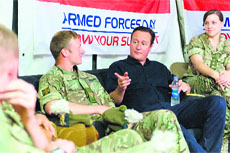 British Prime Minister David Cameron speaks with troops at Camp Bastion in Helmand province on Saturday. 