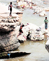 Children take a dip in the Ghaggar