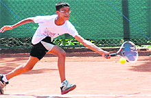 Vikram plays a shot during a tennis tournament at Sector 8, Panchkula, on Sunday