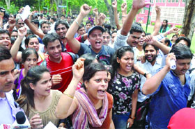 Students shout slogans during a protest against the Kirori Mal College administration. About 1,200 UGC NET candidates couldn't appear for the exam in the college at Delhi University on Sunday.