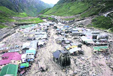 The Kedarnath shrine, Rudraprayag, surrounded by the debris.