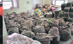 The relief food material lying stacked for almost a week at the CCR makeshift relief aid hall in Haridwar. 