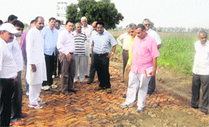 Deputy Commissioner Pankaj Aggarwal inspects a common path at Badwasni village on Sunday. 