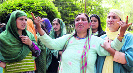 Kashmiri women mourn the killing of two youths allegedly in Army firing in the Sumbal area of Bandipora district on Sunday.