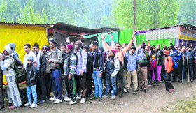 Pilgrims near the Nunwan base camp in Pahalgam head for the Amarnath cave shrine on Sunday.