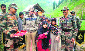 Girls inaugurate a medical camp organised by the Army at Dudi village in the Kashmir valley on Sunday.