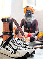 A physically-challenged Sadhu waits for his registration for Amarnath yatra in Jammu on Sunday