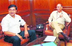 New Union Home Secretary Anil Goswami (right) with outgoing Home Secretary RK Singh after taking charge at North Block in New Delhi on Sunday. 