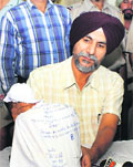 A police official shows the opium seized on Sunday.