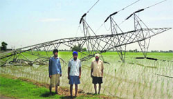 One of the uprooted 220 KV towers in Fatehgarh Sahib on Sunday