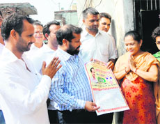 A candidate for the sarpanchs post canvasses along with his supporters at Davi Nagan village near Amritsar on Sunday. 