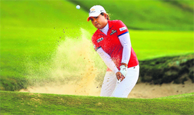 Inbee Park of South Korea hits out of the sand on the eighteenth hole during the third round of the US Womens Open on Saturday.