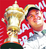 Nico Rosberg is all smiles after his victory. An alleged flag infringement, for a while, threatenened to spoil his victory.