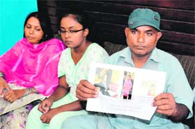 Suraj Kumar Jaiswal shows photos of his daughter to mediapersons in Amritsar on Monday