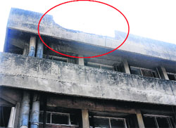 A damaged portion (encircled) of Nehru Hospital. Renovation of the building is on the cards. Tribune Photo: Pradeep Tewari 