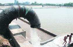 A pipeline fills a water tank at Sector 1 in Panchkula. Tribune photo: Nitin Mittal