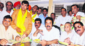HJC chief Kuldeep Bishnoi and BJP leaders address a press conference at the launch of their drive Gaon gaon chalo, ghar ghar chalo in Karnal on Monday. 