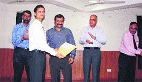 The Principal Secretary of the Haryana Tourism Department Corporation, Vijay Vardhan (third from right), flanked by the guest of honour, Deputy Commissioner Mandeep Singh Brar (extreme left), and the special guest of honour, Haryana Tourism Development Director-General, Anand Mohan Sharan, gives away a certificate to a diploma holder at Jyotisar.