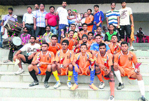 Kewal Singh Pathania presents the ONGC All-India Football trophy to the  winners of the final at Kangra on Monday. 