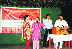 Artistes performe during a cultural evening at Kalakote on Sunday. A Tribune photograph