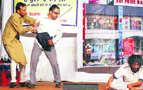 Artists perform in the play "Aam Aadmi" highlighting the problem of inflation at Yadgaar Hall in Jalandhar on Monday. The play was organised by Life Theatre Group.