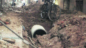 A road dug up by the Municipal Council authorities for laying drainage pipes in Jagraon. 