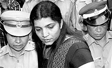 Saritha S Nair being produced in the solar panel duping case at a court in Pathanamthitta on Monday. The case relates to fraudulent solar panel installation deals offered by a firm owned by Saritha Nair and her friend Biju. Kerala's CM Oommen Chandy is allegedly involved in the fraud