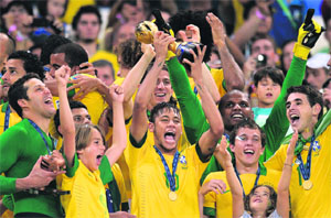 The Brazilian team celebrates after winning the Confederations Cup, at the Maracana Stadium in Rio de Janeiro. Brazil defeated world champions Spain 3-0 in the final on Sunday.